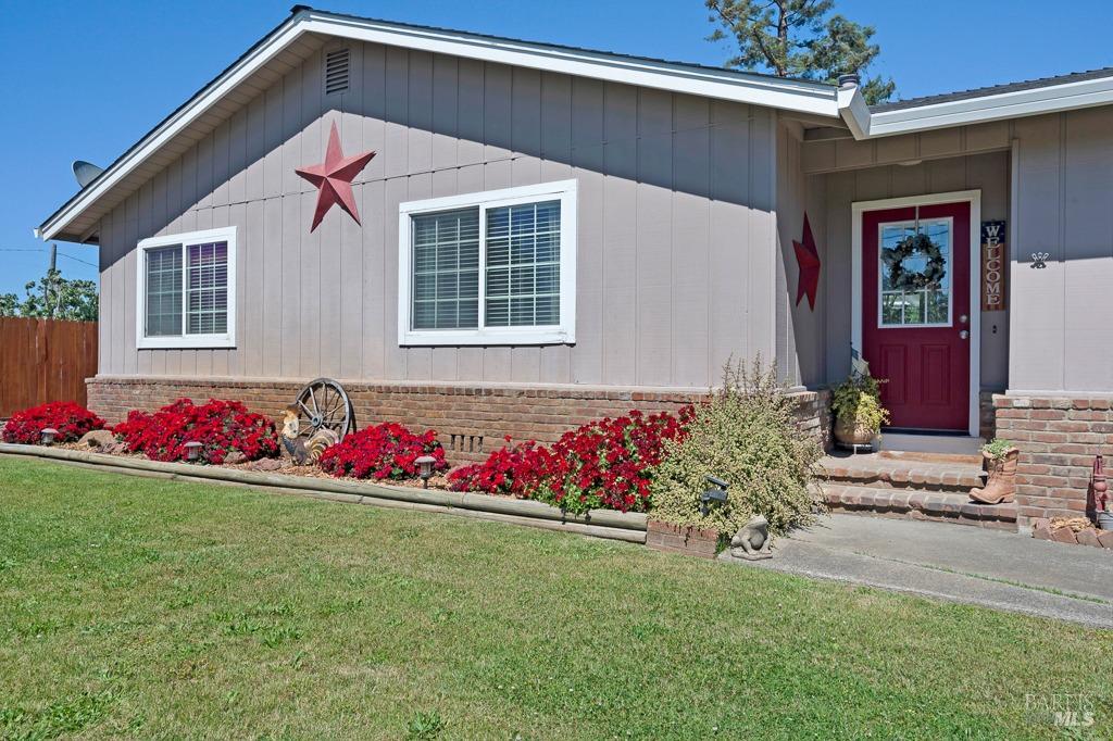 23180 Maffei Road Sonoma, CA 95476 - Photo 11 of 61 Sun, lawn, brick veneer accents with low maintenance colorful landscape.