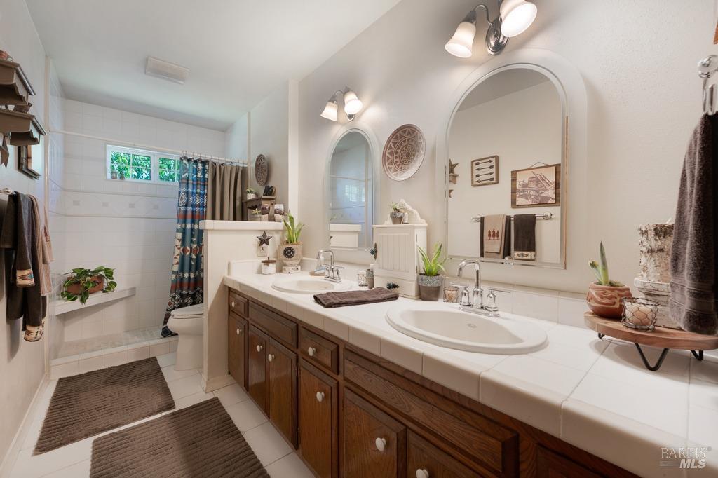 23180 Maffei Road Sonoma, CA 95476 - Photo 25 of 61 Hall bathroom - 2 vanities - stand up tile shower.