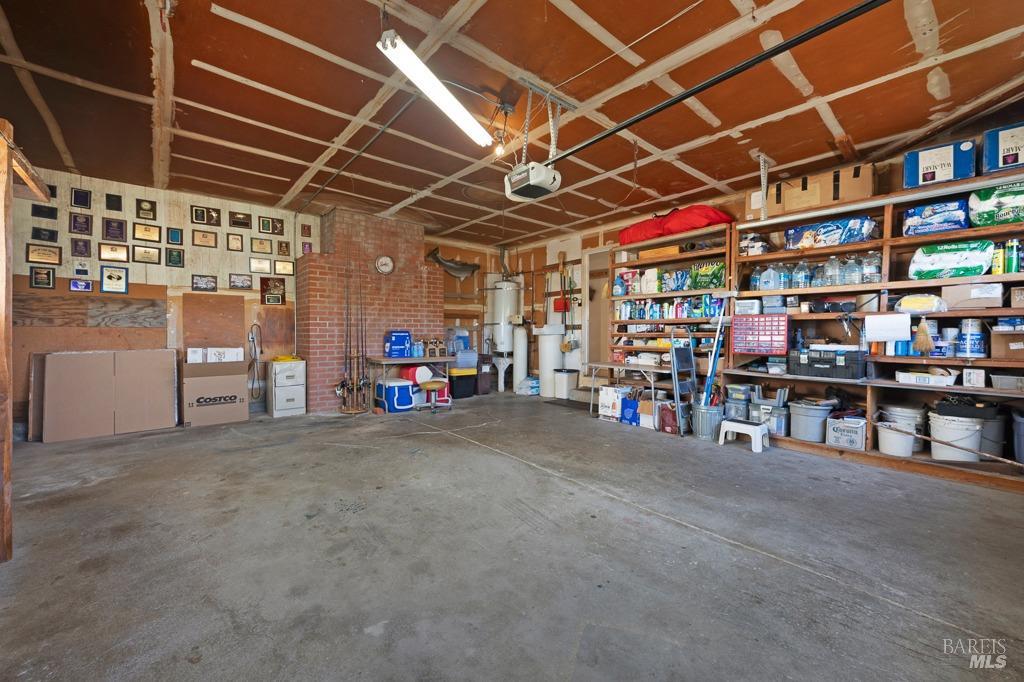 23180 Maffei Road Sonoma, CA 95476 - Photo 31 of 61 Inside garage is spacious and plenty of shelf storage.