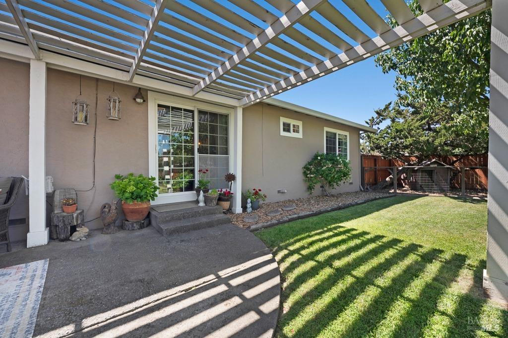 23180 Maffei Road Sonoma, CA 95476 - Photo 33 of 61 From back yard looking to slider in great room and a real lawn.