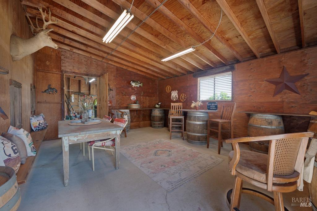 23180 Maffei Road Sonoma, CA 95476 - Photo 47 of 61 Inside bar with door to the shop.