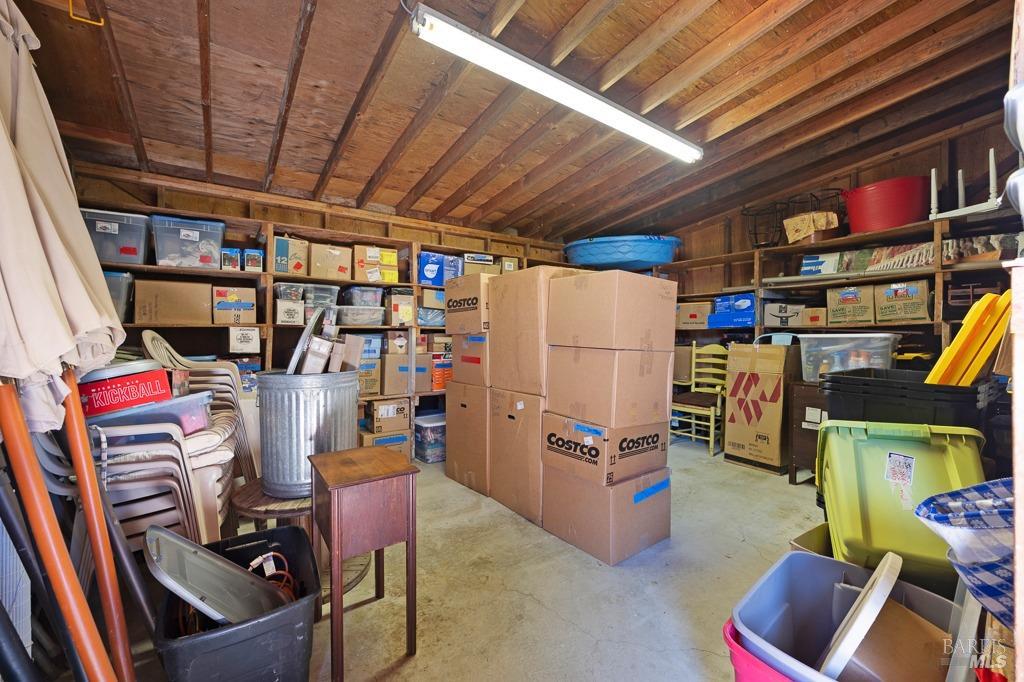 23180 Maffei Road Sonoma, CA 95476 - Photo 50 of 61 Storage room with ample space + shelves enter through bar.