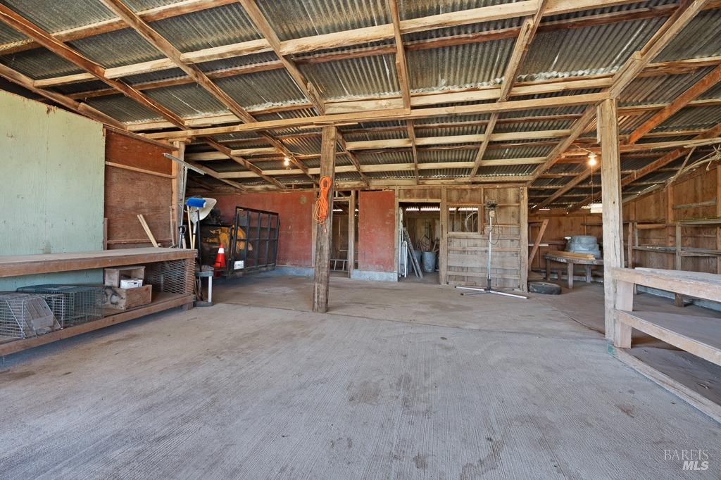 23180 Maffei Road Sonoma, CA 95476 - Photo 56 of 61 Inside barn looking towards rooms.