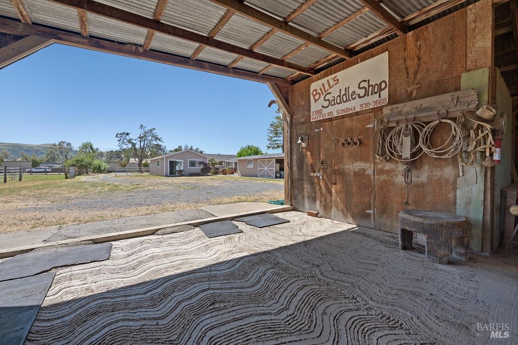 23180 Maffei Road Sonoma, CA 95476 - Photo 57 of 61 In barn look out to front with the tack room entrance on the right.