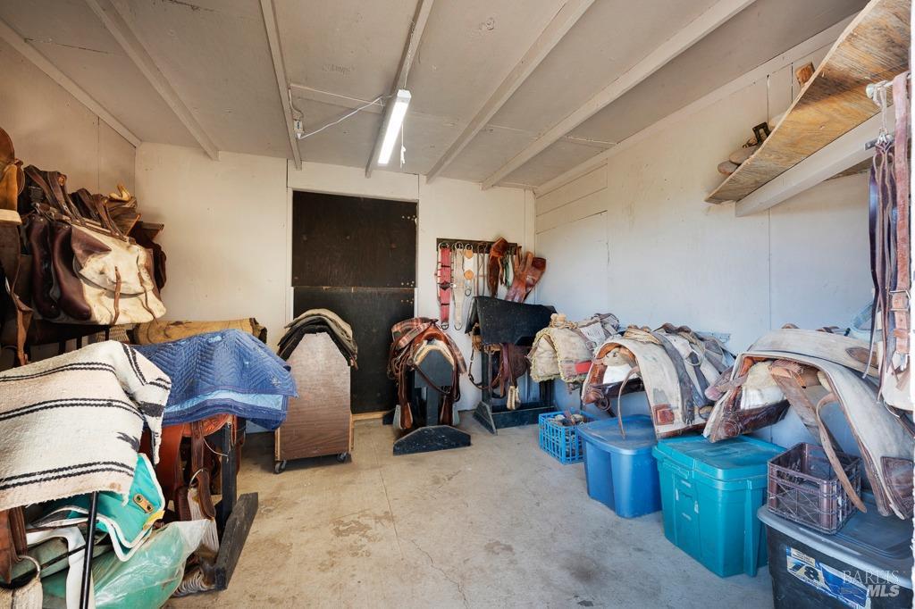 23180 Maffei Road Sonoma, CA 95476 - Photo 58 of 61 Inside tack room with a additional passage door to the other side of the barn.