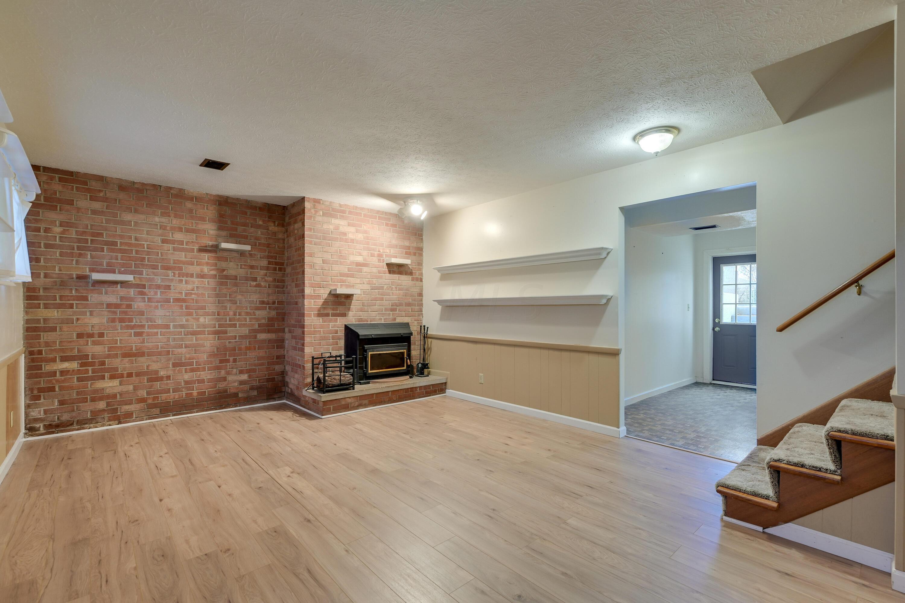 5516 Driftwood Road Columbus, OH 43229 - Photo 19 of 35 Lower level Family Room with Wood burning stove insert