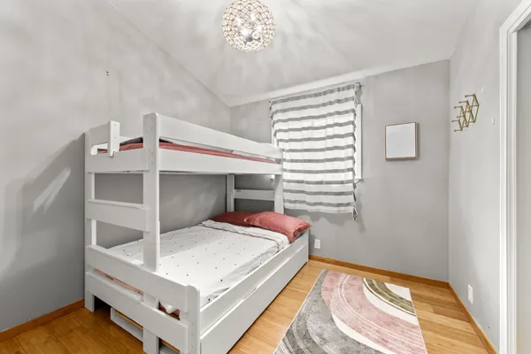 a bedroom with a bed and a table