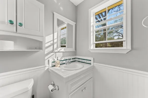 a bathroom with a glass door shower