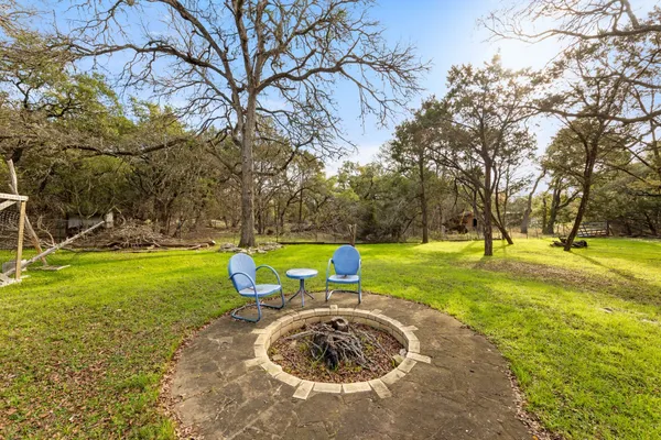 a view of a house with swimming pool and sitting area