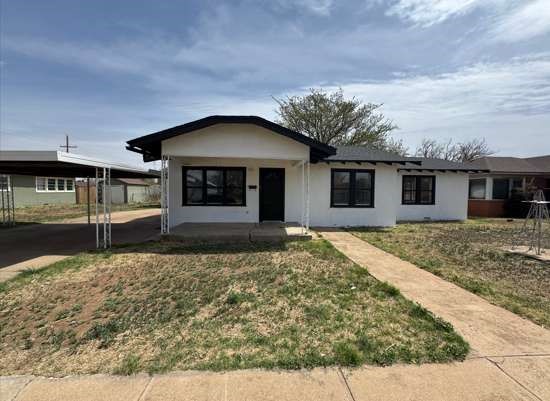 front view of a house with a yard
