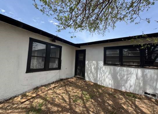910 South 11th Street Slaton, TX 79364 - Photo 11 of 11 a front view of a house with a yard