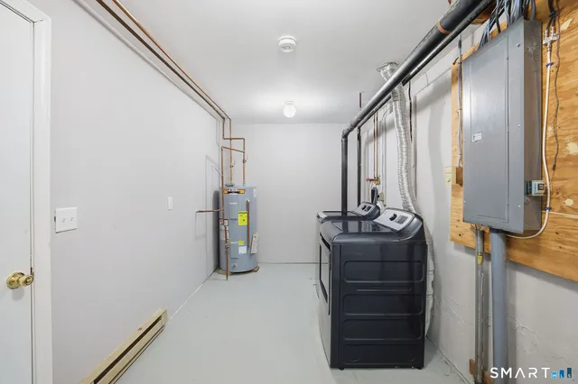 a room with a walk in closet and mirror