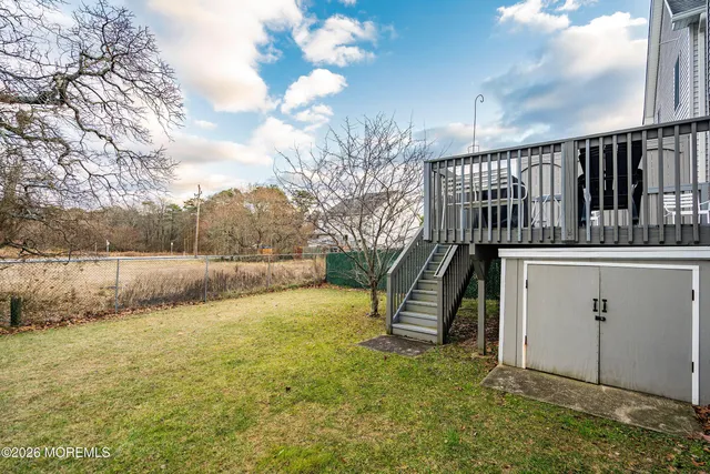 a view of a house with swimming pool and sitting area