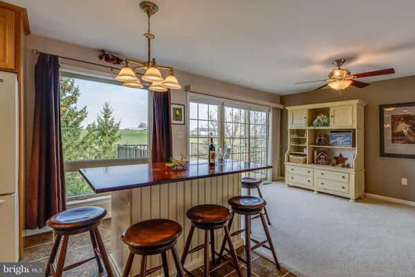 a kitchen with stainless steel appliances granite countertop a stove and a microwave