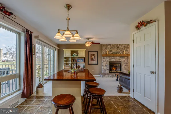 a kitchen with stainless steel appliances granite countertop a stove and cabinets