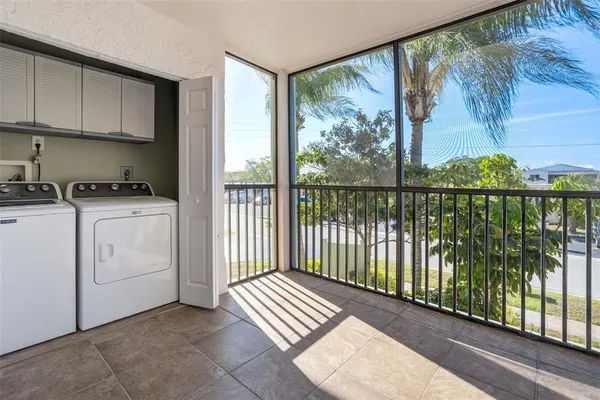 a view of a kitchen with furniture and staircase