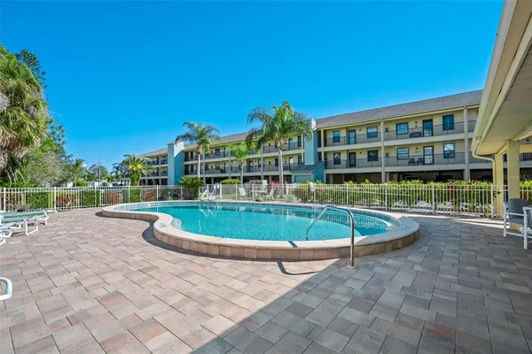 a view of a swimming pool and a yard