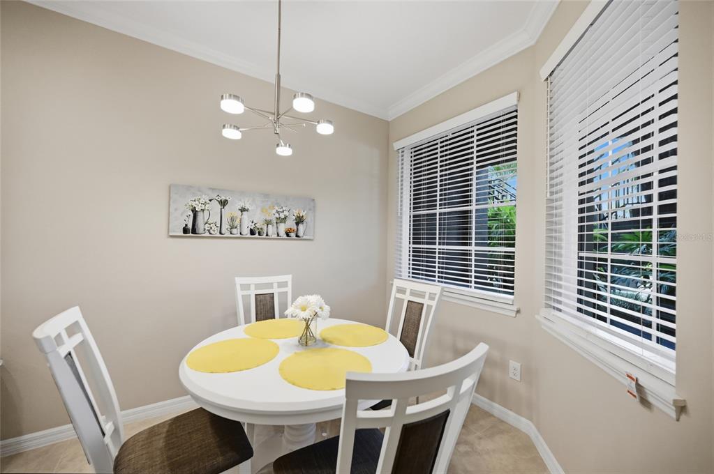 13837 Messina Loop, Unit 101 Bradenton, FL 34211 - Photo 12 of 51 a view of a dining room with furniture and window