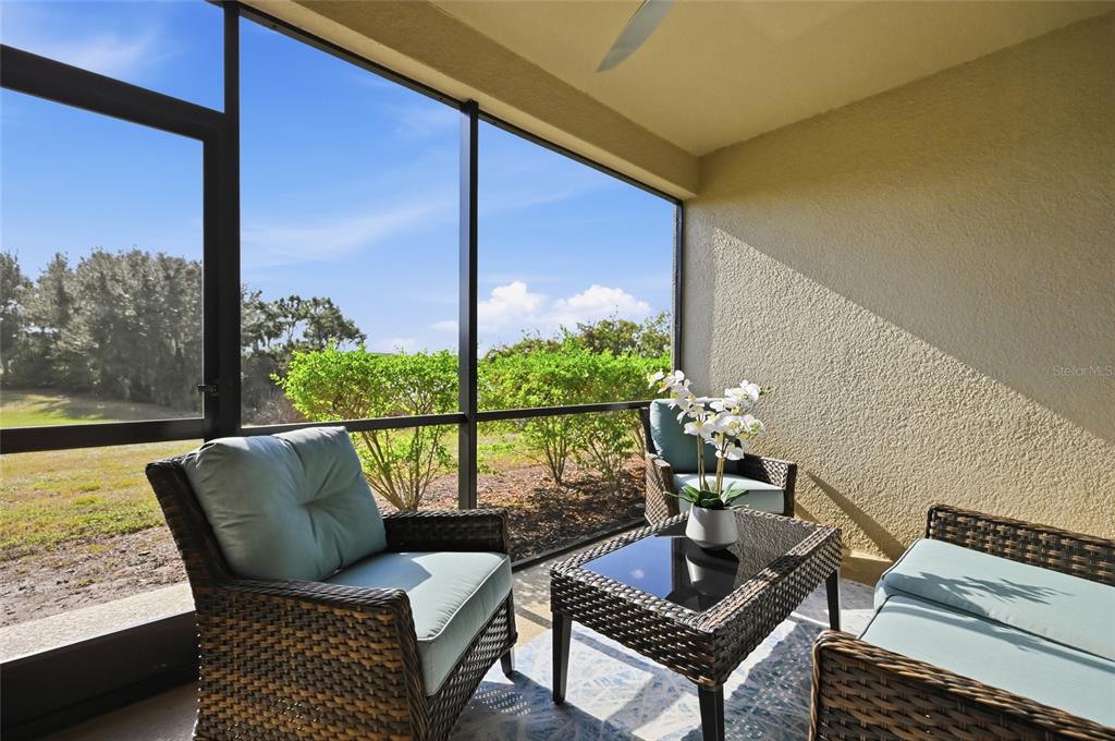 13837 Messina Loop, Unit 101 Bradenton, FL 34211 - Photo 24 of 51 a outdoor living room with furniture