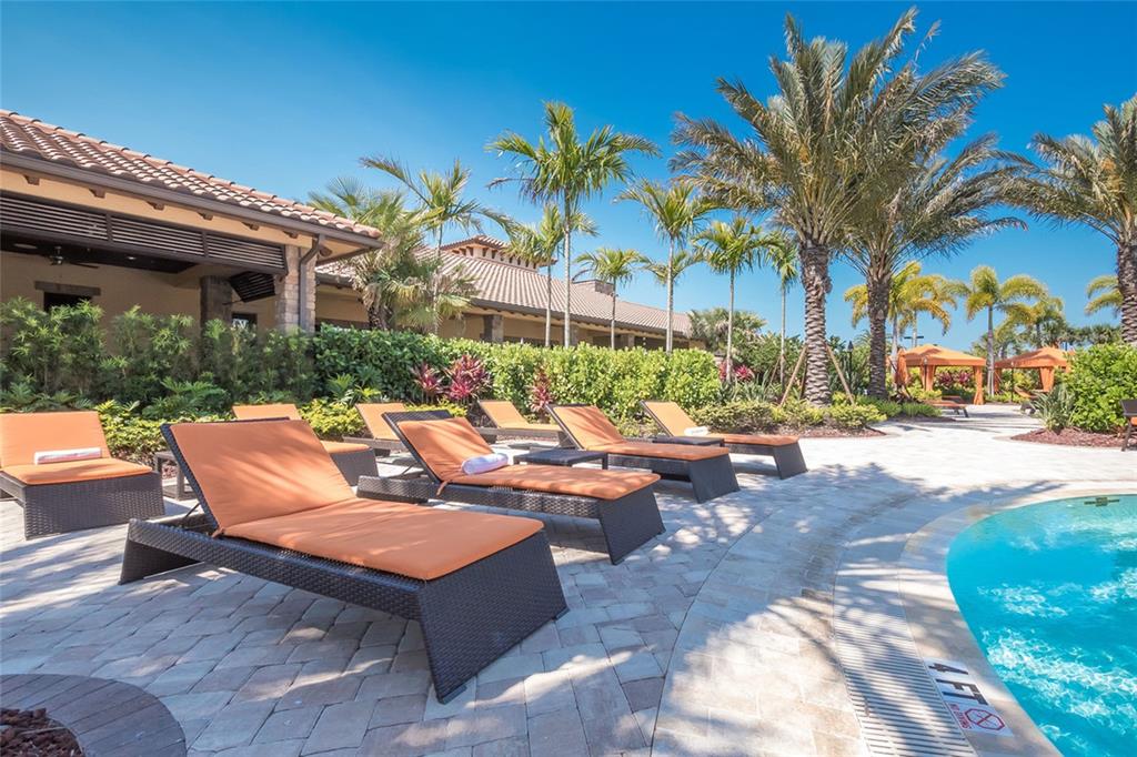 13837 Messina Loop, Unit 101 Bradenton, FL 34211 - Photo 32 of 51 a view of a patio with couches and a fire pit