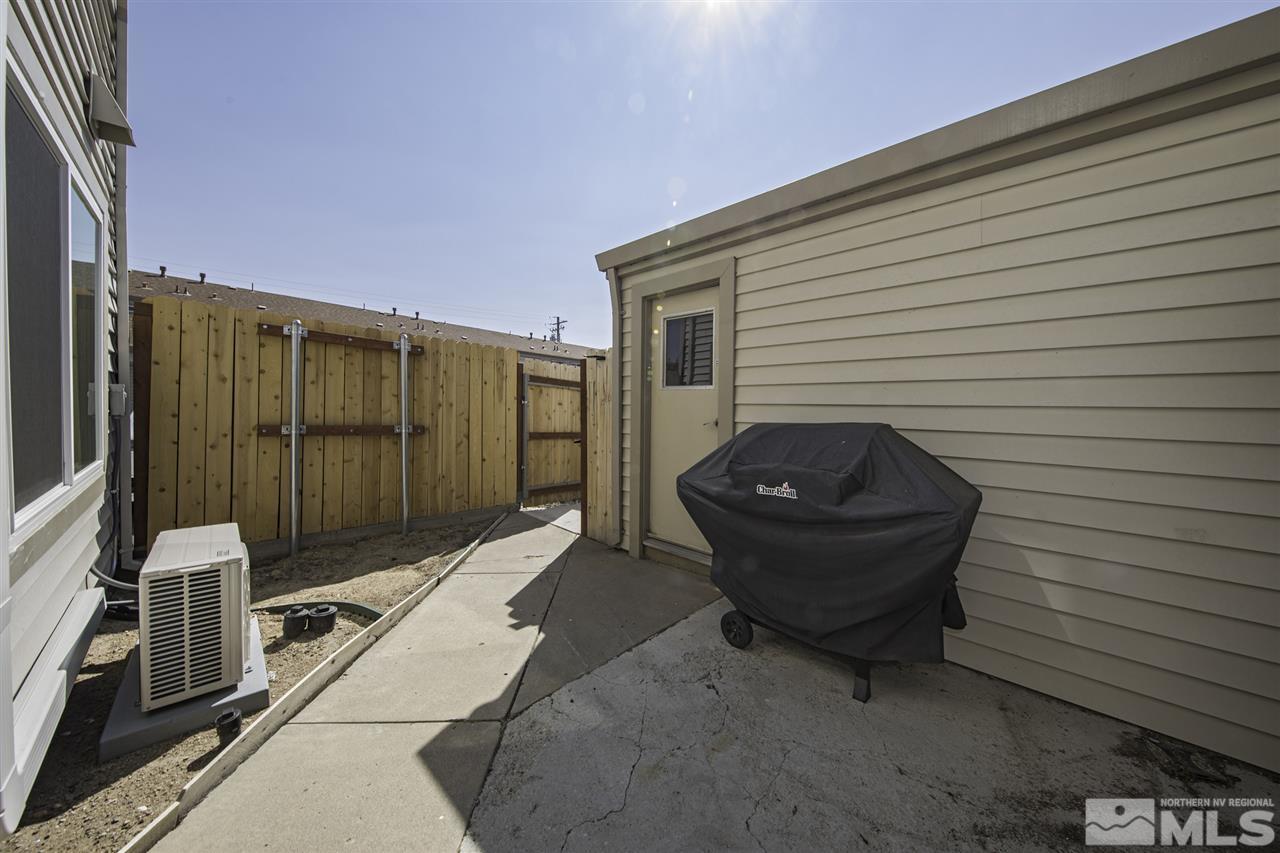 13860 Lear Boulevard Reno, NV 89506 - Photo 18 of 22 a view of a backyard with table and chairs