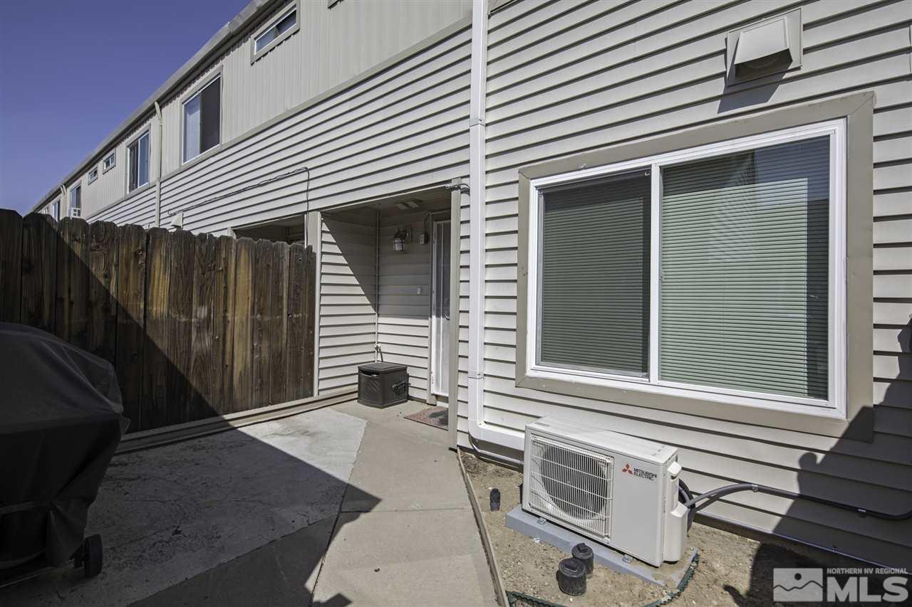 13860 Lear Boulevard Reno, NV 89506 - Photo 19 of 22 a backyard of a house with a table and chairs