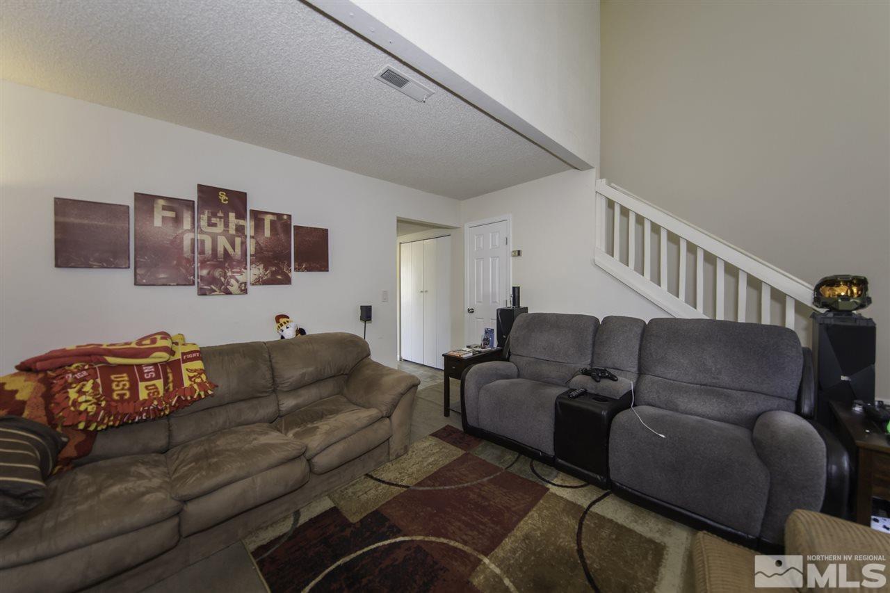 13860 Lear Boulevard Reno, NV 89506 - Photo 8 of 22 a living room with furniture and a couch