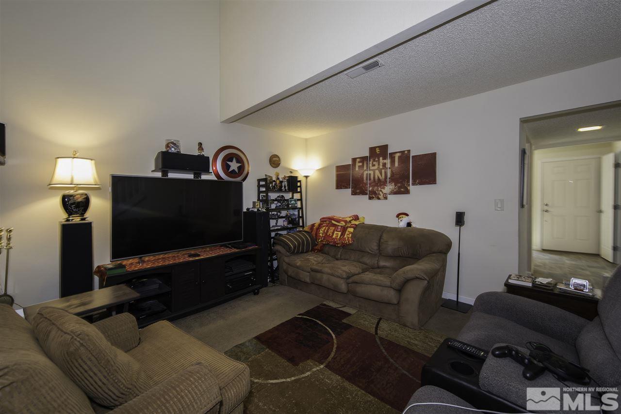 13860 Lear Boulevard Reno, NV 89506 - Photo 10 of 22 a living room with furniture and a flat screen tv