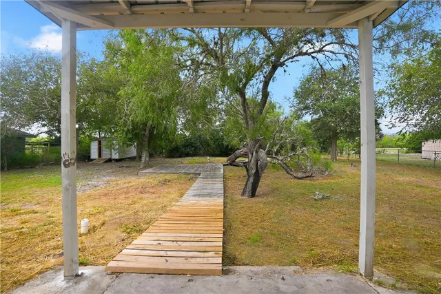 a view of a swimming pool with a patio