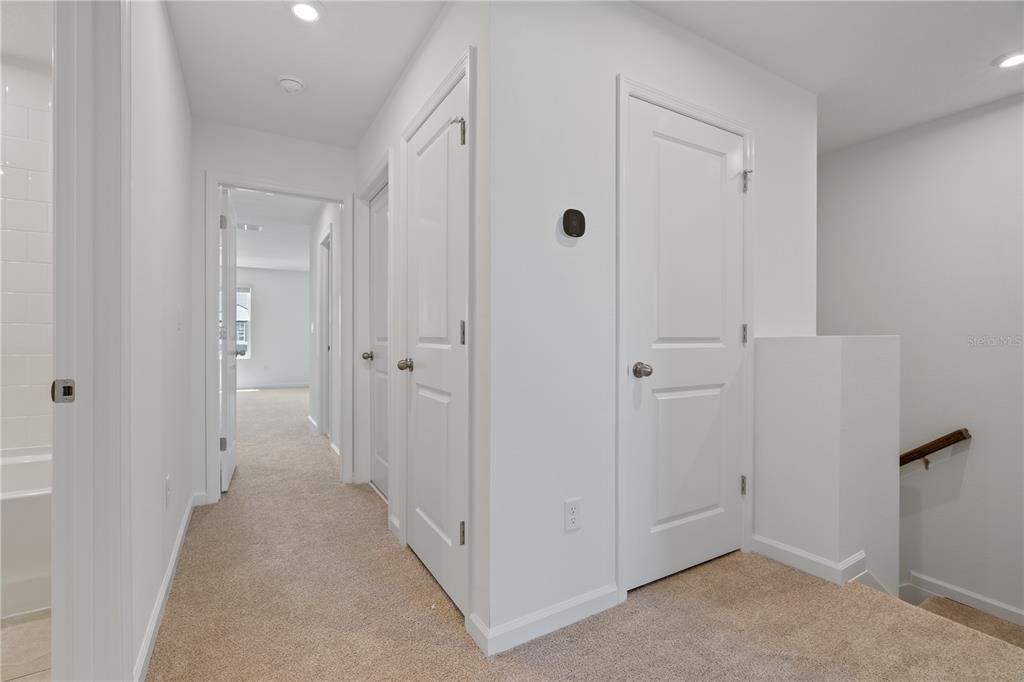 1141 Seaside Mist Trail Kissimmee, FL 34747 - Photo 14 of 30 a view of a hallway with an entryway door
