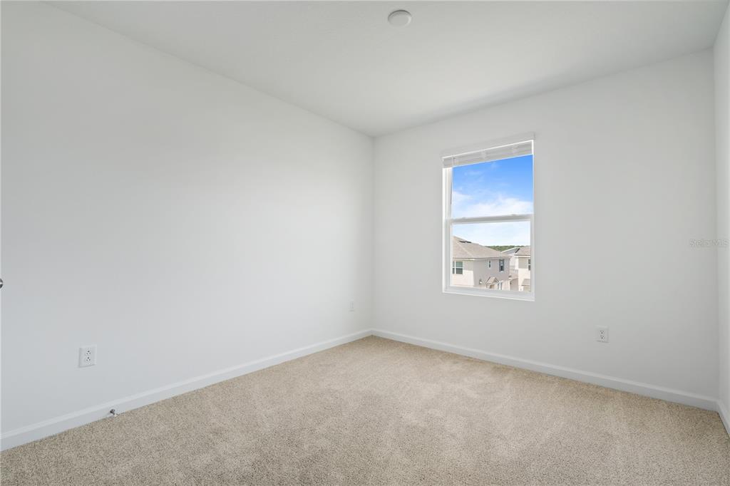 1141 Seaside Mist Trail Kissimmee, FL 34747 - Photo 15 of 30 a view of an empty room and a window