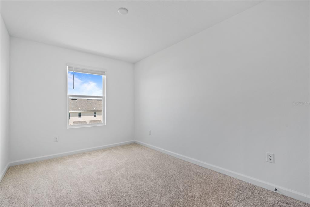 1141 Seaside Mist Trail Kissimmee, FL 34747 - Photo 18 of 30 a view of an empty room with a window