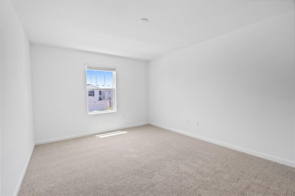 1141 Seaside Mist Trail Kissimmee, FL 34747 - Photo 22 of 30 a view of an empty room with a window