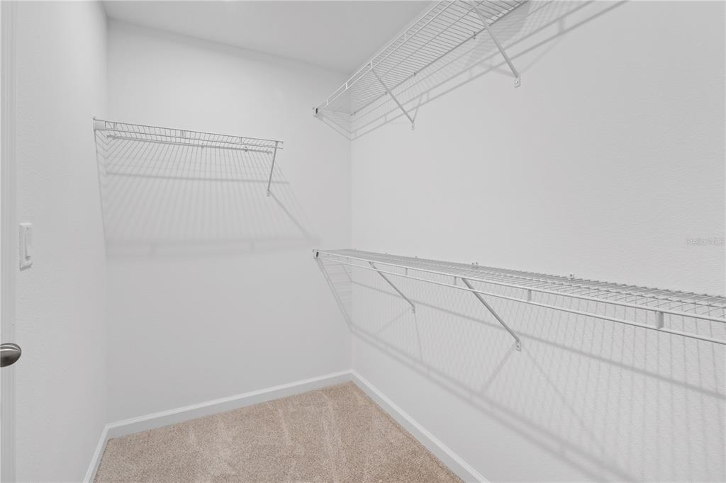 1141 Seaside Mist Trail Kissimmee, FL 34747 - Photo 24 of 30 a view of a room with racks on the wall