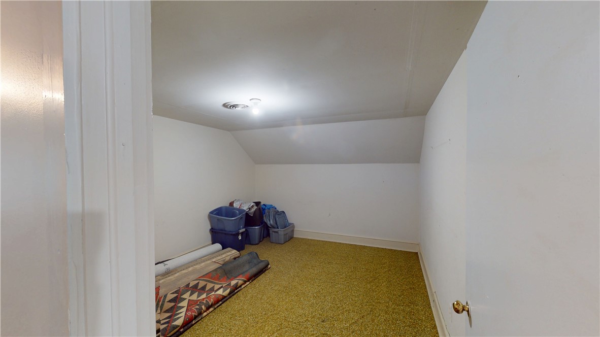 415 Church Street Pendleton, SC 29670 - Photo 29 of 35 A compact storage room with sloped ceilings and plush carpeting.