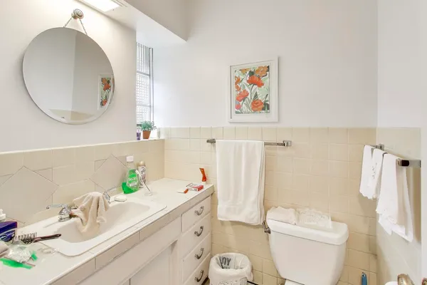 a bathroom with a sink and mirror