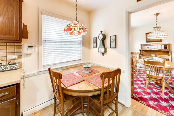 a dining room with furniture and window