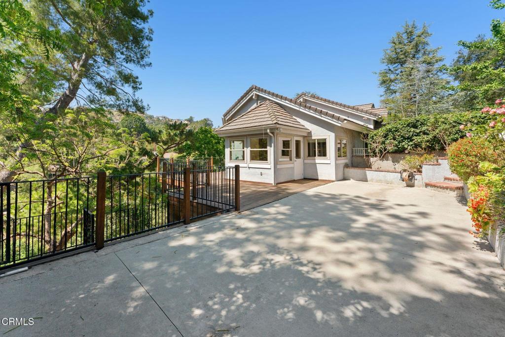 405 Woodcliffe Road Pasadena, CA 91105 - Photo 55 of 65 a front view of a house with a yard