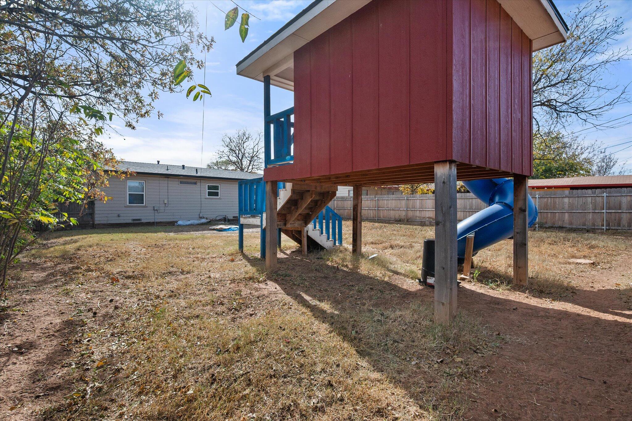 5006 42nd Street Lubbock, TX 79414 - Photo 17 of 19 a house view with a backyard space