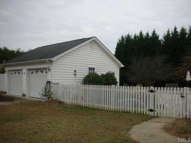 7617 Kennebec Road Willow Spring, NC 27592 - Photo 12 of 12 Detached 2 car garage, to the right is the attached 2 car garage....that's 4 CAR GARAGE TOTAL! Detached garage has electric, A/C, attic storage, private side door entrance....a guy's dream!!!