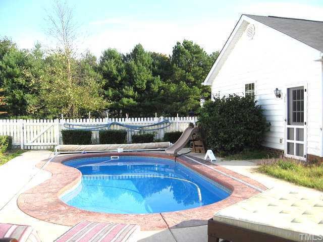 7617 Kennebec Road Willow Spring, NC 27592 - Photo 2 of 12 Private built -in pool with easy to use Safety Cover. Done swimming ? Pull the cover on to protect the little one from falling in the pool. The Safety Cover is so sturdy you can WALK on it! Deck and Patio to enhance your summer entertaining.