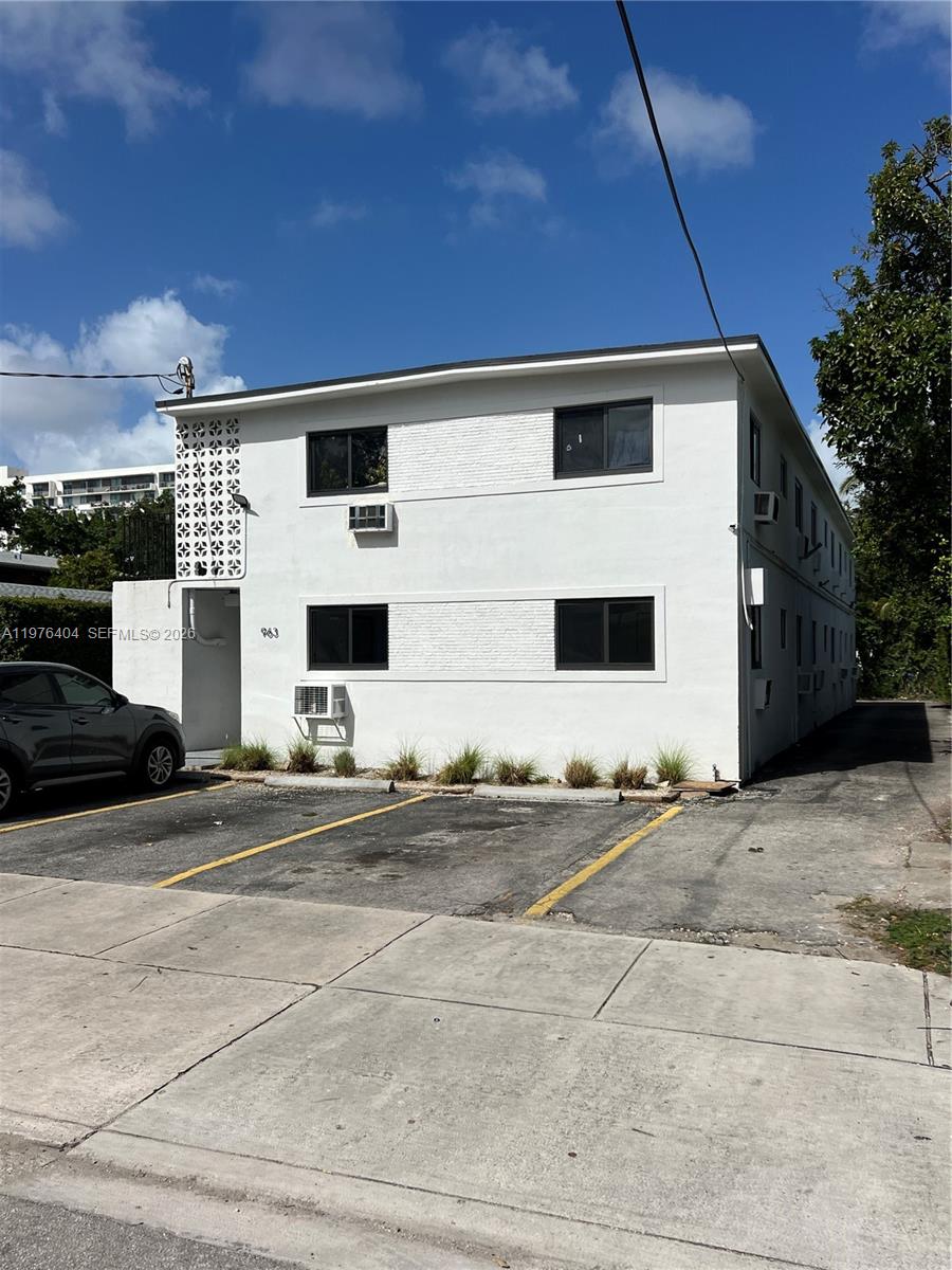 963 Northwest 5th Street, Unit 3 Miami, FL 33128 - Photo 12 of 12 a front view of a house with a yard