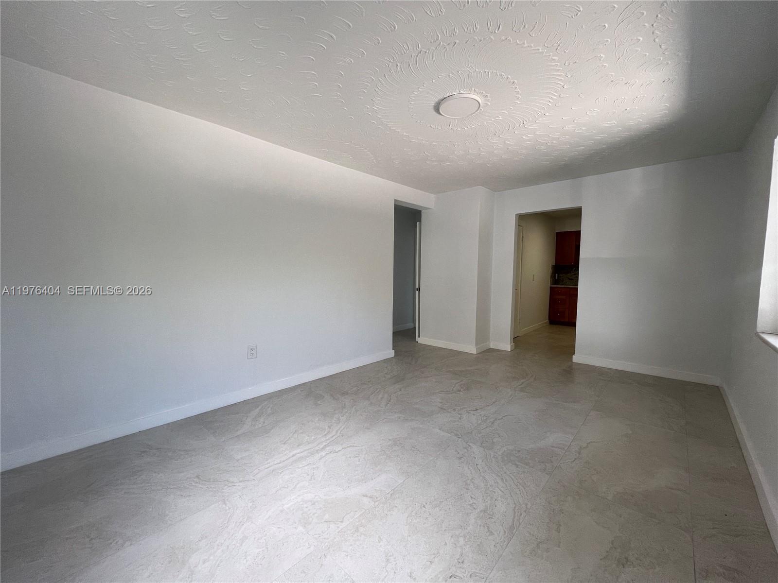 963 Northwest 5th Street, Unit 3 Miami, FL 33128 - Photo 2 of 12 a view of an empty room