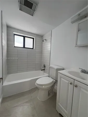 a bathroom with a sink a toilet and a bathtub