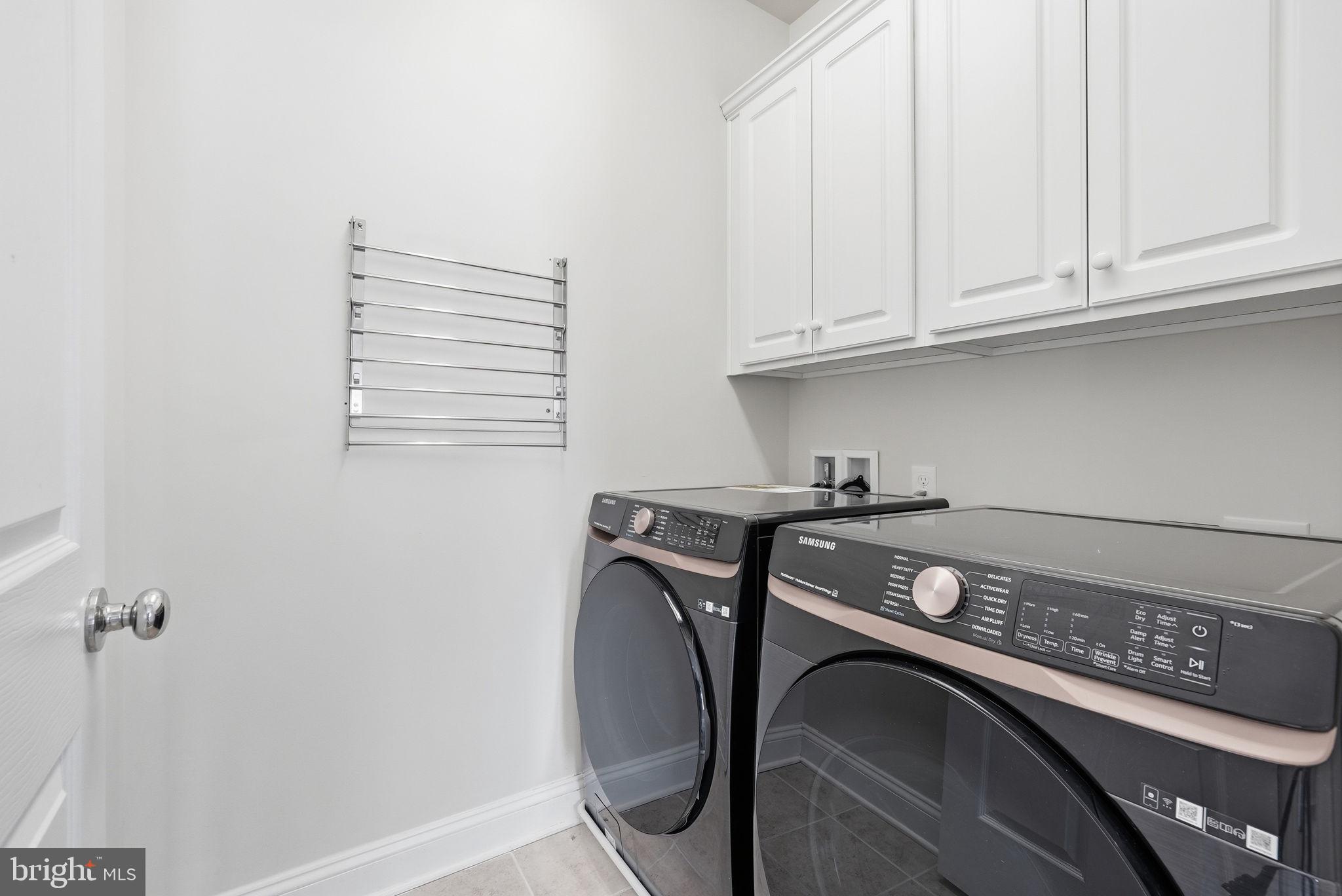 42330 Christophers View Terrace Ashburn, VA 20148 - Photo 22 of 46 a utility room with dryer and washer