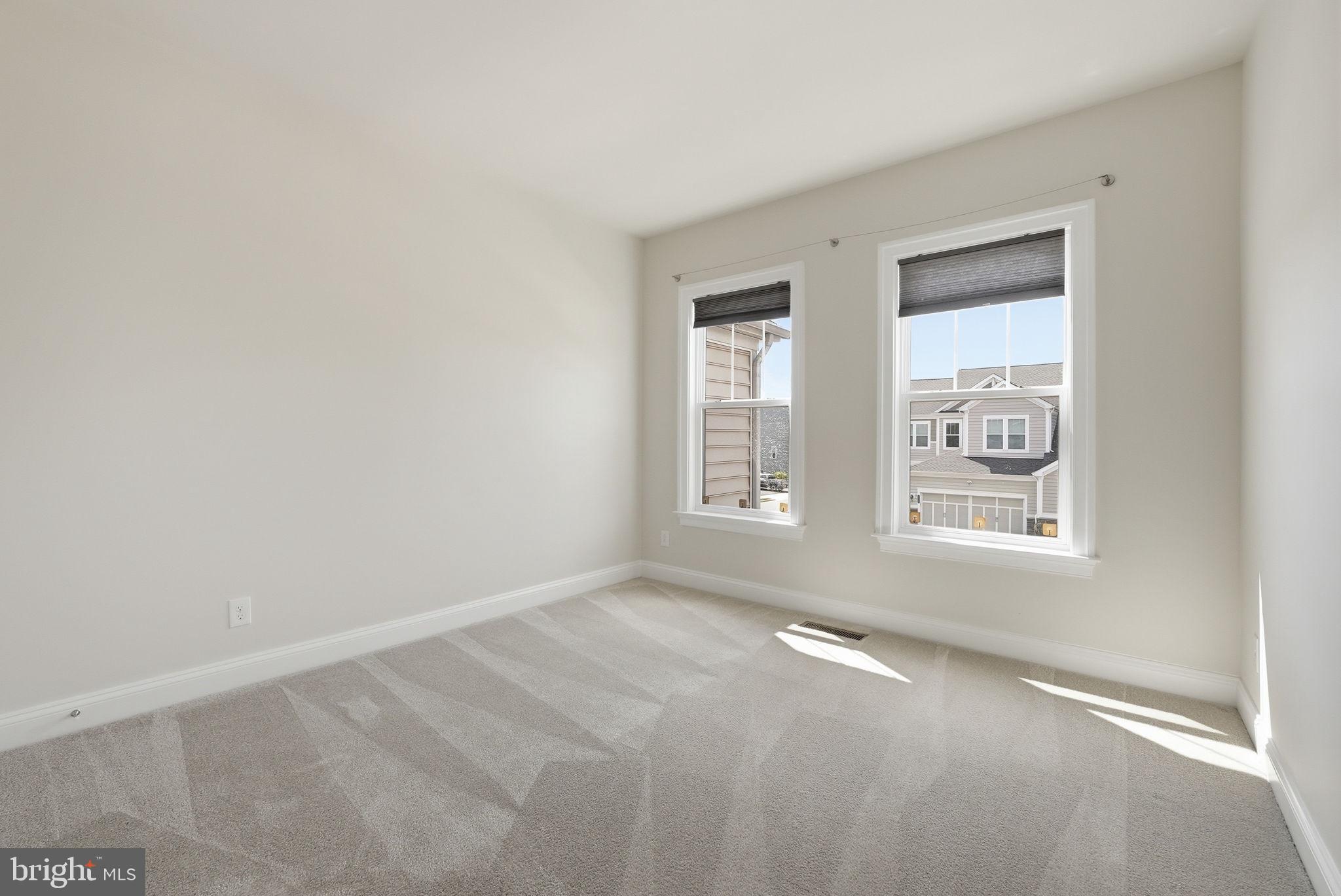 42330 Christophers View Terrace Ashburn, VA 20148 - Photo 23 of 46 an empty room with windows