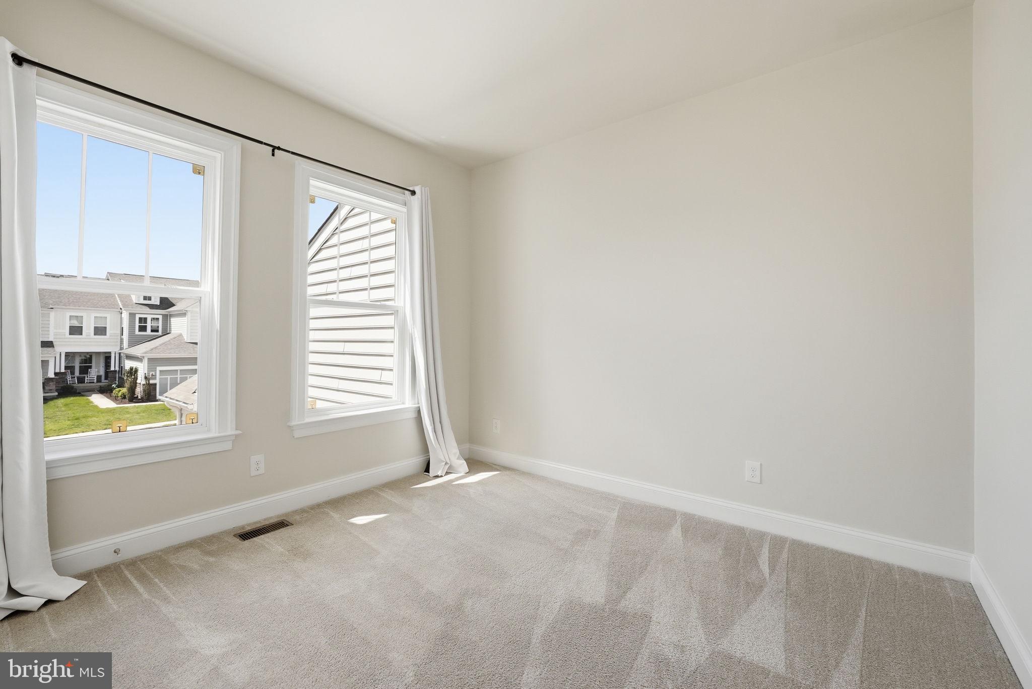 42330 Christophers View Terrace Ashburn, VA 20148 - Photo 24 of 46 a view of an empty room with a window