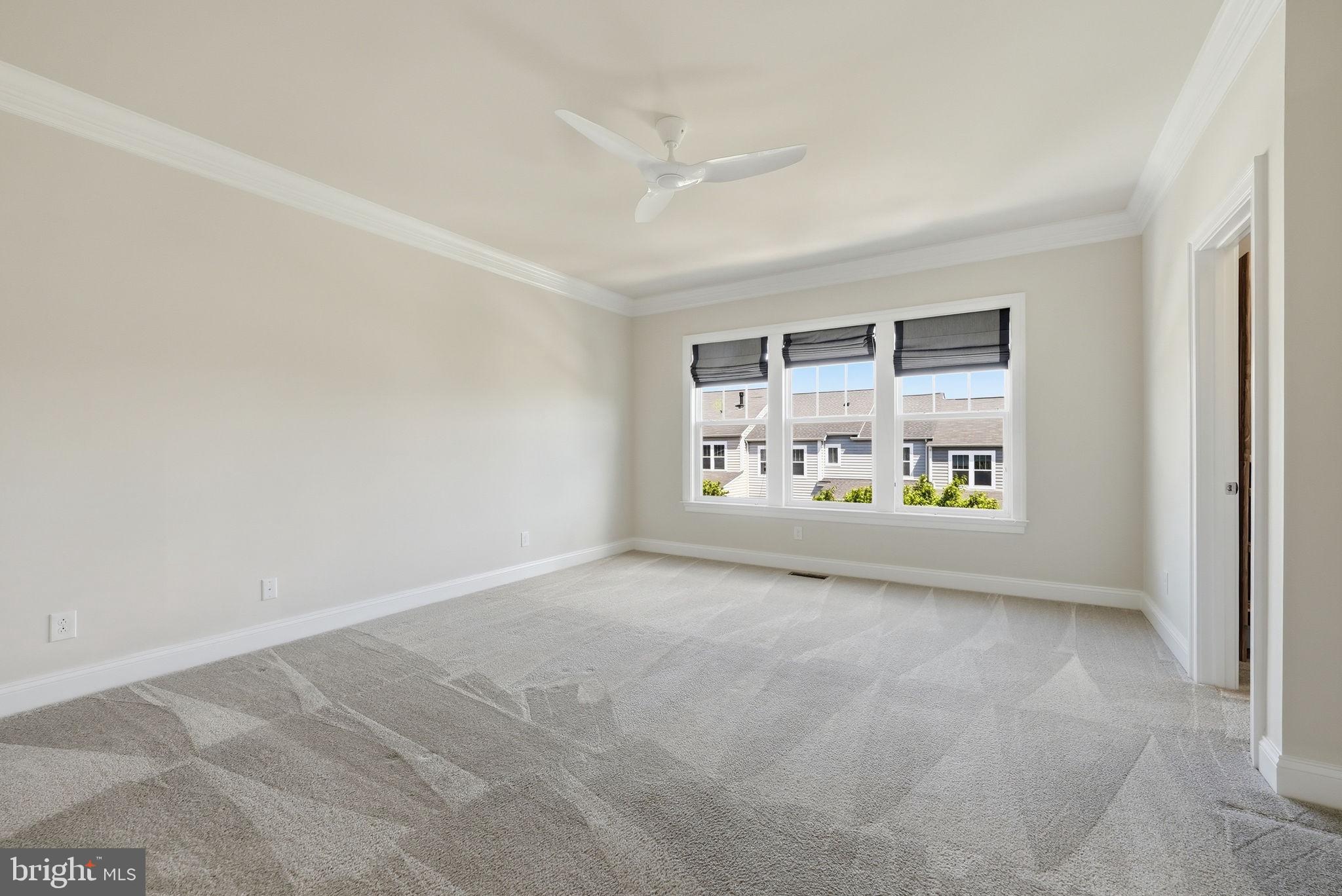42330 Christophers View Terrace Ashburn, VA 20148 - Photo 27 of 46 an empty room with windows and entrance