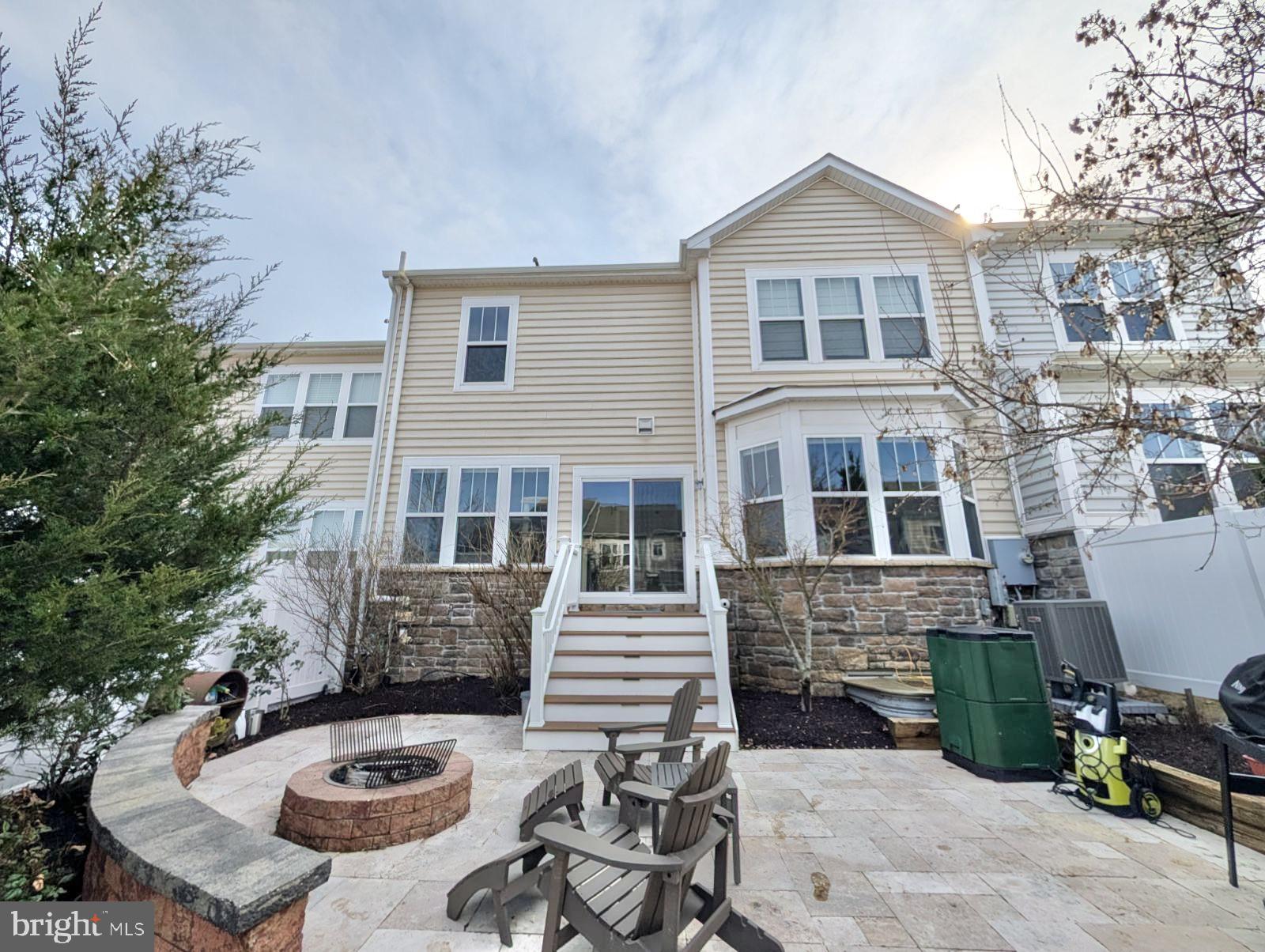 42330 Christophers View Terrace Ashburn, VA 20148 - Photo 3 of 7 a front view of a house with patio