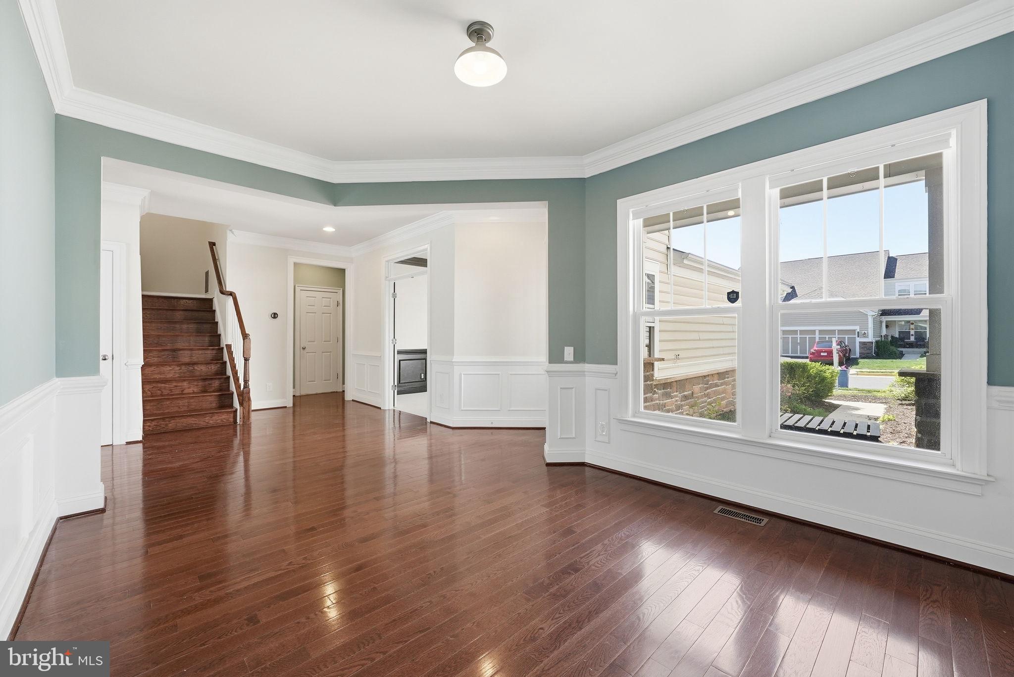 42330 Christophers View Terrace Ashburn, VA 20148 - Photo 5 of 46 wooden floor in an empty room with a window